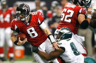 ATLANTA - DECEMBER 06:  Darren Howard #90 of the Philadelphia Eagles sacks quarterback Chris Redman #8 of the Atlanta Falcons at Georgia Dome on December 6, 2009 in Atlanta, Georgia.  (Photo by Kevin C. Cox/Getty Images)
