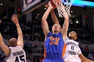OKLAHOMA CITY - MARCH 18: Erik Murphy #33 of the Florida Gators drives for a shot attempt against Brandon Davies #0 of the BYU Cougars during the first round of the 2010 NCAA men�s basketball tournament at Ford Center on March 18, 2010 in Oklahoma City, Oklahoma.  (Photo by Ronald Martinez/Getty Images)