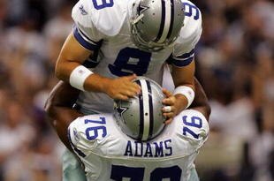 DALLAS - SEPTEMBER 15:  Quarterback Tony Romo #9 of the Dallas Cowboys celebrates a touchdown pass with Flozell Adams #76 against the Philadelphia Eagles in the first quarter at Texas Stadium on September 15, 2008 in Irving, Texas.  (Photo by Ronald Martinez/Getty Images)