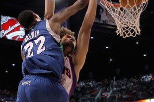 PHOENIX - MARCH 16:  Corey Brewer #22 of the Minnesota Timberwolves slam dunks the ball over Robin Lopez #15 of the Phoenix Suns during the NBA game at US Airways Center on March 16, 2010 in Phoenix, Arizona. NOTE TO USER: User expressly acknowledges and agrees that, by downloading and or using this photograph, User is consenting to the terms and conditions of the Getty Images License Agreement.  (Photo by Christian Petersen/Getty Images)