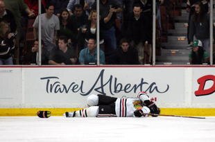 ANAHEIM, CA - MARCH 17:  Brent Seabrook #7 of the Chicago Blackhawks lays on the ice after being checked against the glass in the second period during their NHL game against the Anaheim Ducks at the Honda Center on March 17, 2010 in Anaheim, California.  (Photo by Victor Decolongon/Getty Images)