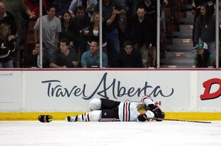 ANAHEIM, CA - MARCH 17:  Brent Seabrook #7 of the Chicago Blackhawks lays on the ice after being checked against the glass in the second period during their NHL game against the Anaheim Ducks at the Honda Center on March 17, 2010 in Anaheim, California.  (Photo by Victor Decolongon/Getty Images)