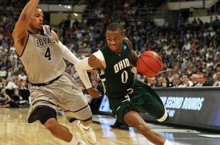 PROVIDENCE, RI - MARCH 18:  Armon Bassett #0 of the Ohio Bobcats drives to the net as Chris Wright #4 of the Georgetown Hoyas defends during the first round of the 2010 NCAA men's basketball tournament on March 18, 2010 at the Dunkin Donuts Arena in Providence, Rhode Island. Ohio defeated Georgetown 97-83.  (Photo by Elsa/Getty Images)