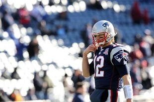 FOXBORO, MA - JANUARY 10:  Tom Brady #12 of the New England Patriots looks on during warm ups against the Baltimore Ravens during the 2010 AFC wild-card playoff game at Gillette Stadium on January 10, 2010 in Foxboro, Massachusetts.  (Photo by Jim Rogash/Getty Images)
