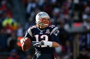 FOXBORO, MA - JANUARY 10:  Tom Brady #12 of the New England Patriots looks to pass against the Baltimore Ravens during the 2010 AFC wild-card playoff game at Gillette Stadium on January 10, 2010 in Foxboro, Massachusetts. The Ravens won 33-14. (Photo by Elsa/Getty Images)