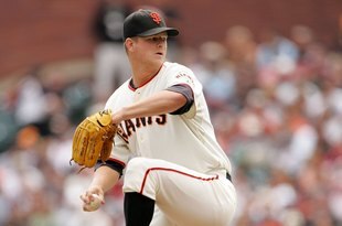 SAN FRANCISCO - AUGUST 30:  Matt Cain #18 of the San Francisco Giants pitches against the Colorado Rockies at AT&T Park on August 30, 2009 in San Francisco, California.  (Photo by Ezra Shaw/Getty Images)