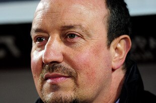LILLE, FRANCE - MARCH 11:  Liverpool manager Rafael Benitez looks on prior to the UEFA Europa League last 16, 1st leg match between Lille and  Liverpool on March 11, 2010 in Lille, France.  (Photo by Mike Hewitt/Getty Images)