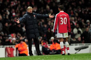 LONDON, ENGLAND - JANUARY 09:  Manager of Arsenal Arsene Wenger speaks to Armand Traore of Arsenal during the Barclays Premier League match between Arsenal and Everton at Emirates Stadium on January 9, 2010 in London, England.  (Photo by Shaun Botterill/Getty Images)