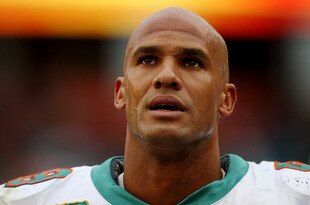 MIAMI - JANUARY 03:  Linebacker Jason Taylor #99 of the Miami Dolphins looks up as the last few moments of the game tick away against the Pittsburgh Steelers calls out a play at the line of scrimmage at Land Shark Stadium on January 3, 2010 in Miami, Florida. The Steelers defeated the Dolphins 30-24.  (Photo by Doug Benc/Getty Images)