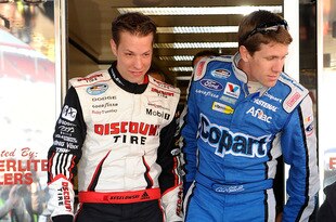 BRISTOL, TN - MARCH 20:  Carl Edwards (R), driver of the #60 COPART Ford, and Brad Keselowski, driver of the #22 Discount Tire Dodge, walk out of the NASCAR hauler at Bristol Motor Speedway on March 20, 2010 in Bristol, Tennessee.  (Photo by Rusty Jarrett/Getty Images for NASCAR)