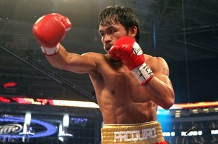 ARLINGTON, TX - MARCH 13:  Manny Pacquiao of the Philippines throws a punch in the ring against Joshua Clottey of Ghana during the WBO welterweight title fight at Cowboys Stadium on March 13, 2010 in Arlington, Texas. Pacquiao defeated Clottey by unanimous decision.  (Photo by Jed Jacobsohn/Getty Images)