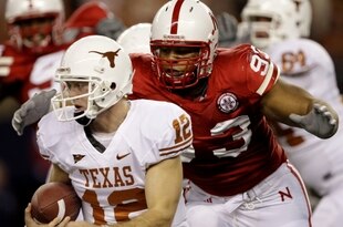 ARLINGTON, TX - DECEMBER 5:  Quarterback Colt McCoy #12 of the Texas Longhorns is sacked by Ndamukong Suh #93 of the Nebraska Cornhuskers in the first quarter of the game at Cowboys Stadium on December 5, 2009 in Arlington, Texas. (Photo by Jamie Squire/Getty Images)