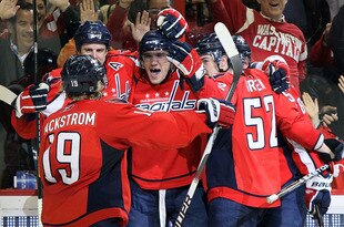 WASHINGTON - MARCH 08:  Alex Ovechkin #8 of the Washington Capitals celebrates his third period goal against the Dallas Stars with his teammates on March 8, 2010 at the Verizon Center in Washington, DC. The Stars defeated the Caps 4-3 after a shootout.  (Photo by Jim McIsaac/Getty Images)