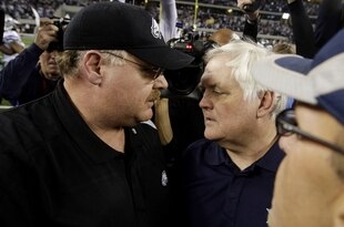 ARLINGTON, TX - JANUARY 9:  (R-L) Head coach Wade Phillips of the Dallas Cowboys talks with head coach Andy Reid of the Philadelphia Eagles after the Cowboys defeated the Eagles 34-14 during the 2010 NFC wild-card playoff game at Cowboys Stadium on January 9, 2010 in Arlington, Texas. (Photo by Jamie Squire/Getty Images)