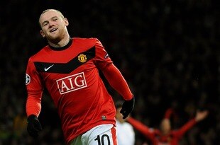 MANCHESTER, ENGLAND - MARCH 10:  Wayne Rooney of Manchester United celebrates scoring the 2nd goal during the UEFA Champions League First Knockout Round, second leg match between Manchester United and AC Milan at Old Trafford on March 10, 2010 in Manchester, England.  (Photo by Laurence Griffiths/Getty Images)
