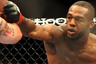 LAS VEGAS - JULY 11:  (R-L) Jon Jones connects with a right punch on Jake O'Brein during their light heavyweight bout during UFC 100 on July 11, 2009 in Las Vegas, Nevada. Jones defeated O'Brein by second round tapout.  (Photo by Jon Kopaloff/Getty Images)