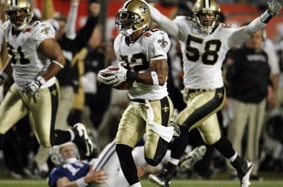 MIAMI GARDENS, FL - FEBRUARY 07: Tracy Porter #22 of the New Orleans Saints intercepts a ball and thrown by Peyton Manning #18 of the Indianapolis Colts and returns it for a touchdown in the fourth quarter during Super Bowl XLIV on February 7, 2010 at Sun Life Stadium in Miami Gardens, Florida. (Photo by Donald Miralle/Getty Images)