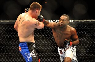 LAS VEGAS - JULY 11:  (R-L) Jon Jones connects with a right punch on Jake O'Brein during their light heavyweight bout during UFC 100 on July 11, 2009 in Las Vegas, Nevada. Jones defeated O'Brein by second round tapout.  (Photo by Jon Kopaloff/Getty Images)
