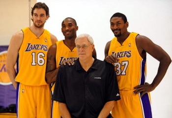 EL SEGUNDO, CA - SEPTEMBER 29:  Pau Gasol #16, Kobe Bryant #24, Coach Phil Jackson and Ron Artest #37 of the Los Angeles Lakers pose for a photograph during Lakers media day at their training facility on  September 29, 2009 in El Segundo, California. NOTE