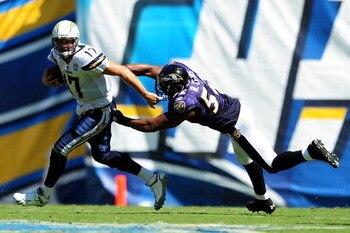 SAN DIEGO - SEPTEMBER 20: Philip Rivers #17 of the San Diego Chargers runs away from Ray Lewis #52 of the Baltimore Ravens at Qualcomm Stadium on September 20, 2009 in San Diego, California.  (Photo by Jacob de Golish/Getty Images)