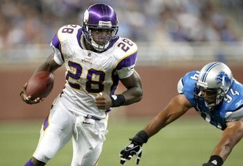 DETROIT - SEPTEMBER 20: Running back Adrian Peterson #28 of the Minnesota Vikings carries the ball past defensive end Coeland Bryan #94 of the Detroit Lions at Ford Field on September 20, 2009 in Detroit, Michigan. The Vikings won 27-13.  (Photo by Stephe
