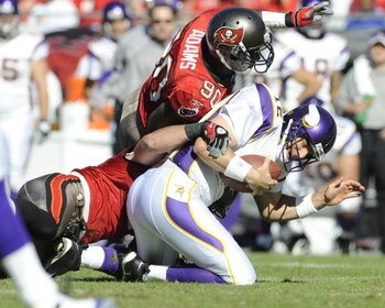 TAMPA, FL - NOVEMBER 16: Defensive end Gaines Adams #90 of the Tampa Bay Buccaneers sacks quarterback Gus Frerotte #12 of the Minnesota Vikings at Raymond James Stadium on November 16, 2008 in Tampa, Florida.  (Photo by Al Messerschmidt/Getty Images) 