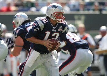 EAST RUTHERFORD, NJ - SEPTEMBER 20:  Tom Brady #12 of the New England Patriots runs with the ball against the New York Jets at Giants Stadium on September 20, 2009 in East Rutherford, New Jersey.  (Photo by Nick Laham/Getty Images)