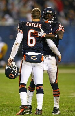 CHICAGO - SEPTEMBER 20: Charles Tillman #33 of the Chicago Bears hugs teammate Jay Cutler #6 after a win over the Pittsburgh Steelers on September 20, 2009 at Soldier Field in Chicago, Illinois. The Bears defeated the Steelers 17-14. (Photo by Jonathan Da