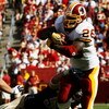 LANDOVER, MD - SEPTEMBER 20:  Running back Clinton Ports #26 of the Washington Redskins picks up a first down on fourth and one while being tackled by Will Witherspoon #51 of the St. Louis Rams during their game on September 20, 2009 at FedEx Field in Lan