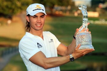 ATLANTA - SEPTEMBER 28:  Camilo Villegas of Colombia holds the trophy in celebration of his sudden death victory over Sergio Garcia to win THE TOUR Championship presented by Coca-Cola, at East Lake Golf Club on September 28, 2008 in Atlanta, Georgia. This