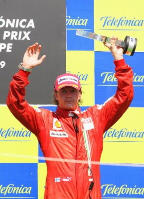 VALENCIA, SPAIN - AUGUST 23:  Kimi Raikkonen of Finland and Ferrari celebrates on the podium after finishing third in the European Formula One Grand Prix at the Valencia Street Circuit on August 23, 2009, in Valencia, Spain.  (Photo by Mark Thompson/Getty