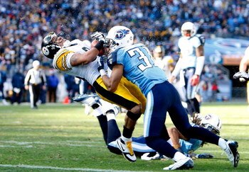 NASHVILLE, TN - DECEMBER 21:  Hines Ward #86 of the Pittsburgh Steelers is hit hard by Cortland Finnegan #31 of the Tennessee Titans as he scores a touchdown during their game on December 21, 2008 at LP Field in Nashville, Tennessee.  (Photo by Streeter L