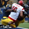 BERKELEY, CA - SEPTEMBER 12:  Eddie Young #9 and Tyson Aluala #44 of the California Golden Bears sack Matt Nichols #16 of the Eastern Washington Eagles at Memorial Stadium on September 12, 2009 in Berkeley, California.  (Photo by Jed Jacobsohn/Getty Image