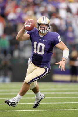 SEATTLE - SEPTEMBER 19:  Quarterback Jake Locker #10 of the Washington Huskies looks to pass the ball against the USC Trojans on September 19, 2009 at Husky Stadium in Seattle, Washington. The Huskies defeated the Trojans 16-13. (Photo by Otto Greule Jr/G