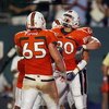 FORT LAUDERDALE, FL - SEPTEMBER 17:  Tight end Jimmy Graham #80 of the Miami Hurricanes celebrates his touchdown catch with offensive linemen Matt Pipho #65 and Jason Fox #64 against the Georgia Tech Yellow Jackets at Land Shark Stadium on September 17, 2