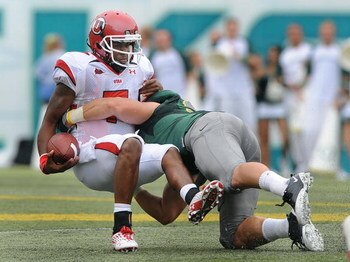 EUGENE, OR - SEPTEMBER 19: Quarterback Terrance Cain #7 of the Utah Utes is sacked by Casey Matthews #55 of the Oregon Ducks gives chase in the third quarter of the game at Autzen Stadium on September 19, 2009 in Eugene, Oregon. Oregon won the game 31-24.