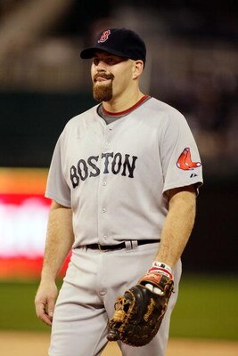 KANSAS CITY, MO - SEPTEMBER 21:  Kevin Youkilis #20 of the Boston Red Sox reacts during the game against the Kansas City Royals on September 21, 2009 at Kauffman Stadium in Kansas City, Missouri.  (Photo by Jamie Squire/Getty Images)