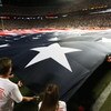 MIAMI - SEPTEMBER 21:  An American flag is spread out over the entire field before the Indianapolis Colts take on the Miami Dolphins at Land Shark Stadium on September 21, 2009 in Miami, Florida. The Colts defeated the Dolphins 27-23.  (Photo by Doug Benc