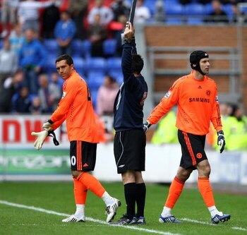WIGAN, ENGLAND - SEPTEMBER 26:  Petr Cech (R) of Chelsea is sent off and changes with Henrique Hilario during the Barclays Premier League match between Wigan Athletic and Chelseaat DW Stadium on September 26, 2009 in Wigan, England.  (Photo by Phil Cole/G