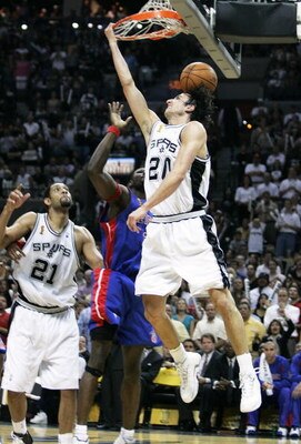 SAN ANTONIO - JUNE 23:  Manu Ginobili #20 of the San Antonio Spurs finishes up a fourth quarter dunk over Ben Wallace #3 of the Detroit Pistons in Game seven of the 2005 NBA Finals at SBC Center on June 23, 2005 in San Antonio, Texas.  NOTE TO USER: User 