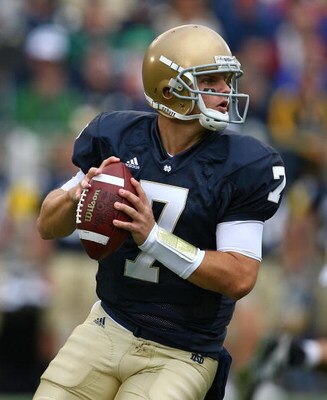 SOUTH BEND, IN - OCTOBER 03: Jimmy Clausen #7 of the Notre Dame Fighting Irish looks for a receiver against the Washington Huskies on October 3, 2009 at Notre Dame Stadium in South Bend, Indiana. Notre Dame defeated Washington 37-30 in overtime. (Photo by