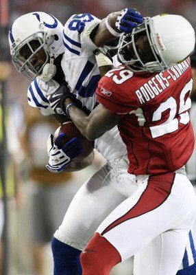 GLENDALE, AZ - SEPTEMBER 27:  Pierre Garcon #85 of the Indianapolis Colts runs after a catch in the fourth quarter as he battles for more yards against Dominique Rodgers-Cromartie #29 of the Arizona Cardinals during the game at University of Phoenix Stadi