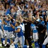 DETROIT, MI - SEPTEMBER 27: Detroit Lions players celebrate the victory as they run on the field after the victory against the Washington Redsklns at Ford Field on September 27, 2009 in Detroit, Michigan. The Lions defeated the Redskins 19-14. (Photo by S
