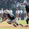 OAKLAND, CA - SEPTEMBER 27:  Zach Miller #80 of the Oakland Raiders recovers a fumble as JaMarcus Russell #2 looks on against the Denver Broncos on September 27, 2009 during an NFL game at the Oakland-Alameda County Coliseum in Oakland, California.  (Phot
