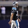 ARLINGTON, TX - SEPTEMBER 28:  Jake Delhomme #17 of the Carolina Panthers walks off the field after a play against the Dallas Cowboys at Cowboys Stadium on September 28, 2009 in Arlington, Texas. (Photo by Ronald Martinez/Getty Images)