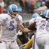 EAST RUTHERFORD, NJ - SEPTEMBER 27:  Kerry Collins #5 hands off to Chris Johnson #28 of The Tennessee Titans in action against the New York Jets during their game on September 27, 2009 at Giants Stadium in East Rutherford, New Jersey.  (Photo by Al Bello/