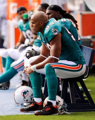 SAN DIEGO - SEPTEMBER 27:  Linebacker Jason Taylor #99 of the Miami Dolphins  reacts on the sideline during their loss to San Diego Chargers, 23-13, during the NFL football game at Qualcomm Stadium on September 27, 2009 in San Diego, California.  (Photo b