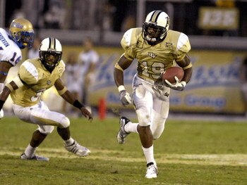 ORLANDO, FL - OCTOBER 20:  Defensive back Joe Burnett #19 of the University of Central Florida Golden Knights returns a kick against the Tulsa Golden Hurricane at Bright House Stadium on October 20, 2007 in Orlando, Florida.  (Photo by Al Messerschmidt/Ge