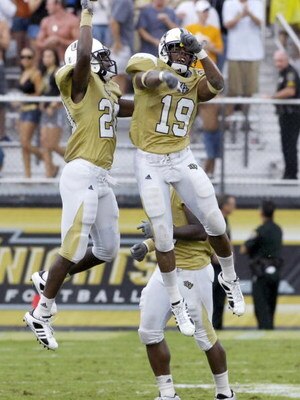 ORLANDO, FL - SEPTEMBER 15:  Defensive back Joe Burnett #19 of the University of Central Florida Knights celebrates an interception with defensive back Darin Baldwin at Bright House Networks Stadium on September 15, 2007 in Orlando, Florida.  The sixth-ra