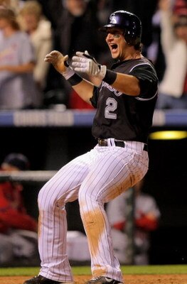 DENVER - SEPTEMBER 25:  Shortstop Troy Tulowitzki #2 of the Colorado Rockies celibrates after scoring the game-winning run against the St. Louis Cardinals on a sacrifice fly by Yorvit Torrealba in the ninth inning at Coors Field on September 25, 2009 in D